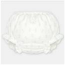 Baby girl bloomer made of woven fabric in white with light blue floral patterns and ruffled edges.