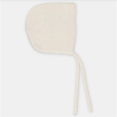 Martin Aranda bonnet in a soft pink knit cotton blend, featuring ties for secure fitting.