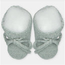 Sweater knit cotton blend booties in a soft mint color with tied laces and rounded toes, suitable for infants.