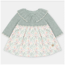 Martin Aranda dress featuring a knitted top in soft green with a lace collar, and a floral fabric skirt in pink and cream tones.