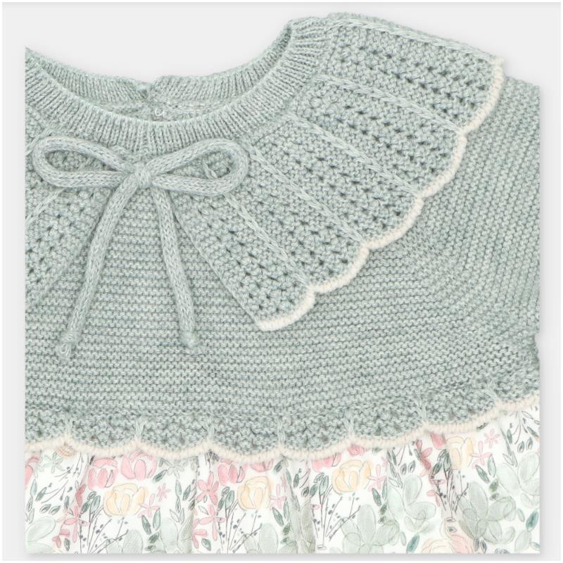 Knitted dress with a light green bodice, decorative collar, and a floral fabric skirt. Perfect for springtime wear.
