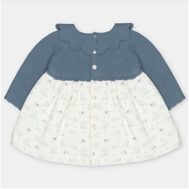 Sweater-knit dress with a blue bodice and white skirt featuring animal patterns and buttons at the front.