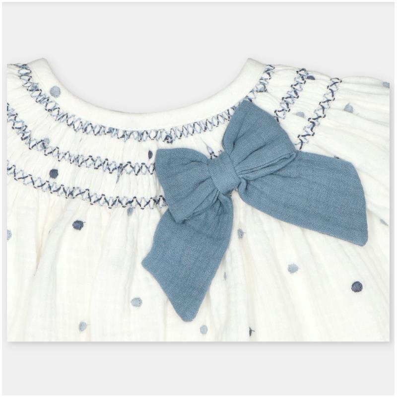 Set dress and bloomer featuring a white woven fabric with blue polka dots and a large blue bow at the neckline.