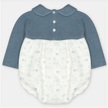 Short romper featuring a blue sweater knit top and a lightweight white bottom with animal prints and floral designs.
