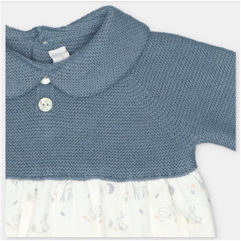 Short romper in sweater knit with a blue top and a patterned white skirt featuring animals.