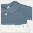 Short romper in sweater knit with a blue top and a patterned white skirt featuring animals.