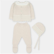 Sweater knit cotton set in aller beige, including a cardigan, leggings with feet, and a bonnet.
