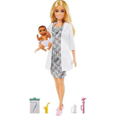 Barbie is dressed as a doctor, holding a baby doll, with medical accessories like a stethoscope and syringe nearby.