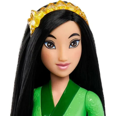 Disney Princess Core Doll of Mulan, featuring black hair, a green outfit, and a yellow crown headpiece.