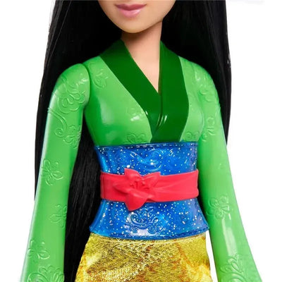 Disney Princess Core Doll Mulan features a green outfit with a blue waist sash and red bow, showcasing her iconic look.