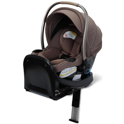 Maxi-Cosi Ambra infant car seat in Truffle color, featuring a protective canopy, padded seating, and safety labels.