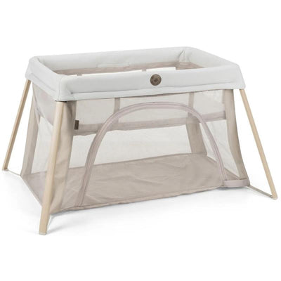 Maxi-Cosi Calao Travel Play Yard in Classic Oat, featuring a soft padded top and breathable mesh sides for visibility and airflow.