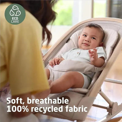 Maxi-Cosi Kori 2-in-1 Rocker in Classic Green, featuring a baby comfortably seated, with soft 100% recycled fabric and Eco Care label.