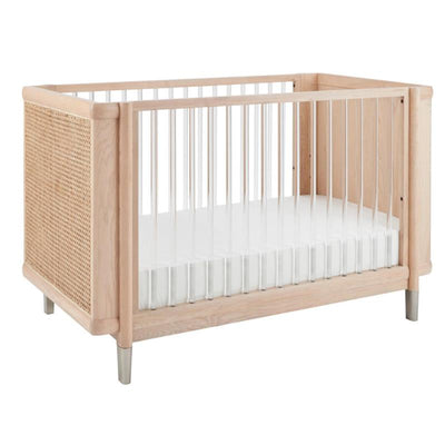 Maxi-Cosi Nursery Brisa 4-in-1 Convertible Crib featuring natural wood, woven sides, and a white mattress platform.