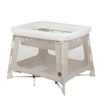 Maxi-Cosi Swift Play Yard in Classic Oat color, featuring a soft, padded top and mesh sides for visibility and airflow.