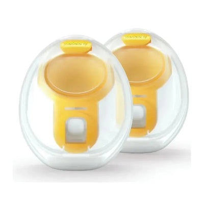Hands-free breast pump collection cups by Medela, featuring a clear design with yellow accents for comfortable use.