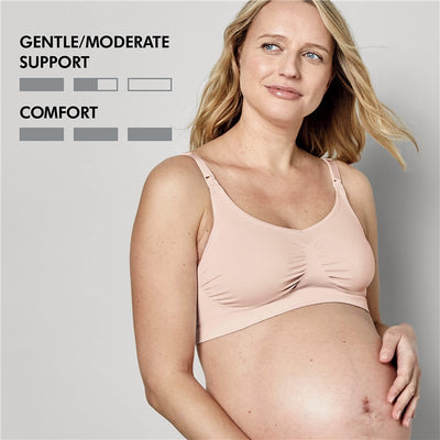 Medela seamless pregnancy bra in chai color, worn by a pregnant woman, highlighting comfort and gentle/moderate support features.