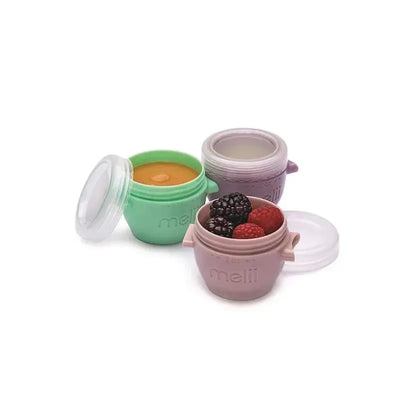 Colorful Melii 2oz snap & go baby food storage containers with lids, holding pureed food and berries.