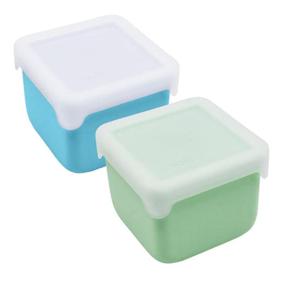 Two silicone snack containers in blue and mint, each with a white lid, holding 236ml/8oz.