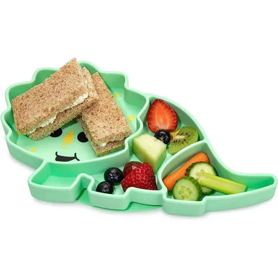 Divided silicone suction plate shaped like a dinosaur, with sections for sandwiches and assorted fruits and vegetables.