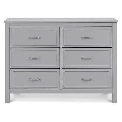 Grey 6-drawer double dresser with metallic handles, featuring a simple, modern design suitable for a nursery or bedroom.