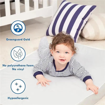 A baby lying on a mattress with safety certifications, surrounded by stylish nursery decor, showcasing hypoallergenic features.