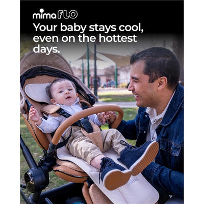 Mima Flo baby cooling seat liner in use with a smiling baby in a stroller, father engaging with child outdoors.
