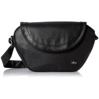 Trendy black changing diaper bag by Mima, featuring a sleek design and adjustable shoulder strap.
