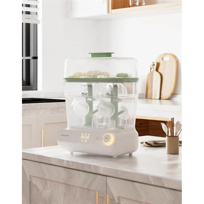 3-layer Momcozy bottle sterilizer and dryer on a kitchen countertop, featuring visible digital controls and bottles inside.