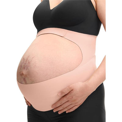 Pregnant person wearing a black top and holding a Momcozy Oyster Pink Pregnancy Belly Band, highlighting its supportive design.