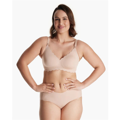 Seamless floral push-up nursing bra in oyster pink worn by a model, featuring scalloped edges and adjustable straps.