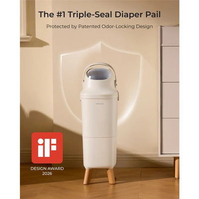 Momcozy Triple-Seal Diaper Pail with odor-locking design, featuring a modern look and wooden legs, displayed in a room.
