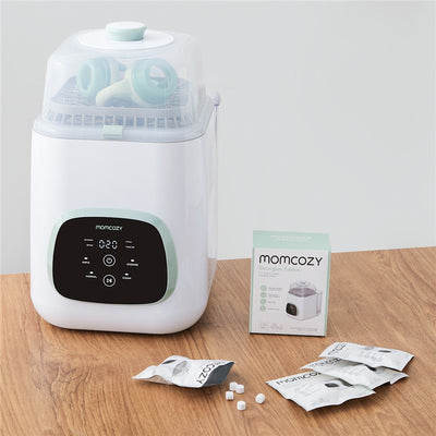 Momcozy Washing Blocks for KleanPal Pro Bottle Washer with 120 count detergent tablets on a wooden surface.