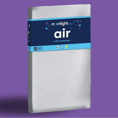 Moonlight Baby Air Crib Mattress features a white quilted surface with a blue label indicating its name and dimensions.
