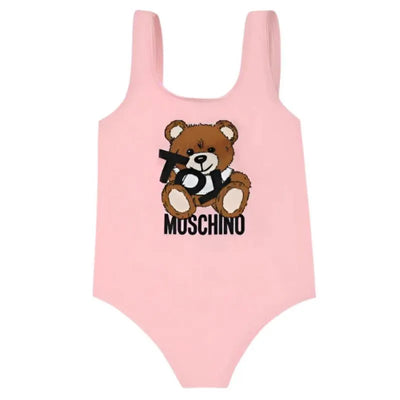 Pink Moschino Baby swimsuit featuring a Toy Bear logo print, designed for girls.
