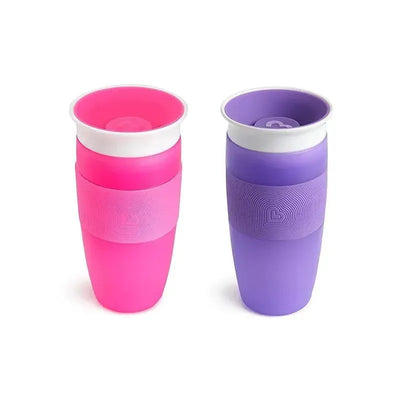 Munchkin Miracle 360 Sippy Cups in pink and purple, featuring a spill-proof design and textured grip.