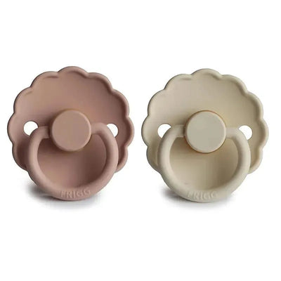 Natural rubber baby pacifiers in blush and cream colors, featuring a daisy-shaped design for infants 0-6 months.