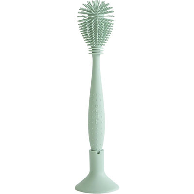 Silicone baby bottle brush in Cambridge Blue, featuring a flexible design and a sturdy stand for easy storage.