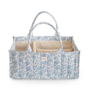 Mushie Baby Diaper Caddy in blue floral design, featuring multiple compartments for organizing newborn essentials.
