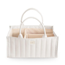 Mushie Baby Diaper Caddy in ivory, featuring two handles and divided compartments for organizing newborn essentials.