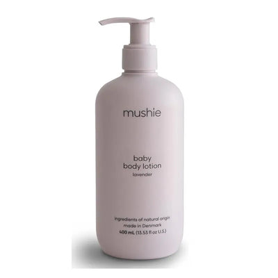 Mushie lavender baby body lotion in a pale pink bottle, 13.53 fl oz, emphasizes natural ingredients and gentle care for babies.