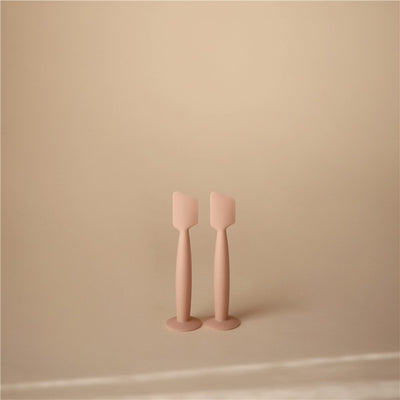 Mushie Diaper Cream Applicator in Blush color, featuring two ergonomic silicone applicators for easy cream application.