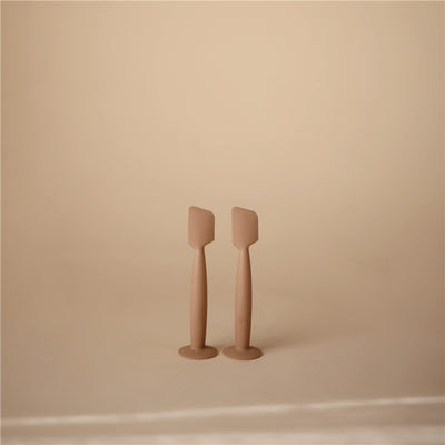 Mushie Silicone Diaper Cream Applicators in natural color, featuring a spatula-like design for easy application.