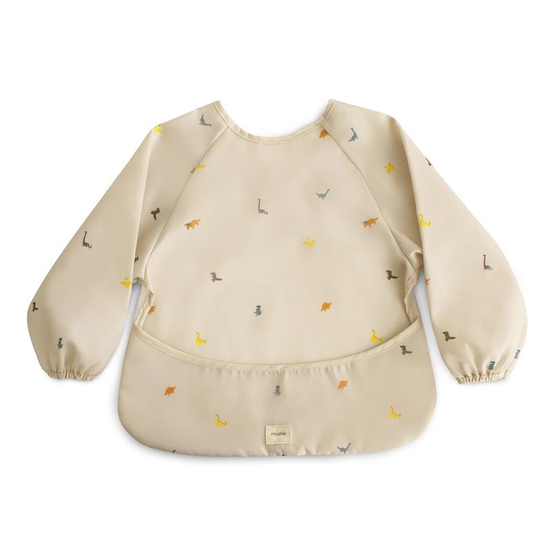 Water-resistant, long-sleeve baby bib with a beige background and colorful dinosaur prints, featuring an adjustable fit.