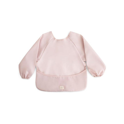 Long sleeve bib in blush color, featuring elastic cuffs and a front pocket for easy cleaning during mealtime.