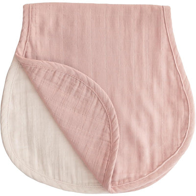 Organic cotton muslin burp cloth in blush and fog colors, showcasing soft, absorbent fabric and rounded edges.