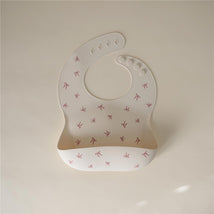 Mushie Silicone Baby Bib - Bows Image 2