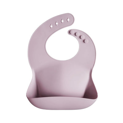 Silicone baby bib in pale mauve color featuring a scoop to catch spills and adjustable neck closure.