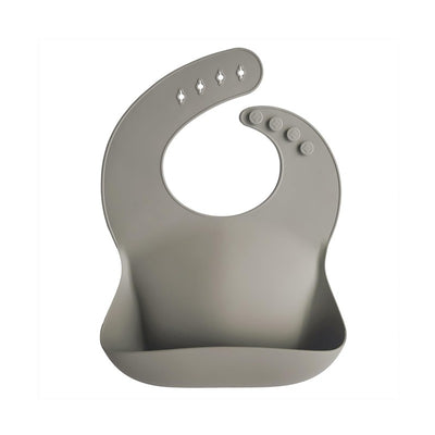 Silicone baby bib in silver sage color, featuring a spacious pocket and five adjustable button holes.