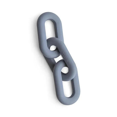 Silicone teether toy from Mushie in a Tradewinds color featuring linked oval shapes for gripping and chewing.